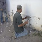 1.2 Liberación de muro de adobe de muro de concreto y piedra tipo “forma menonita” en exterior